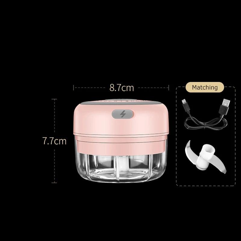 Hachoir électrique rose avec récipient transparent et lames