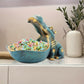 Hippopotame décoratif avec fruits dans la bouche