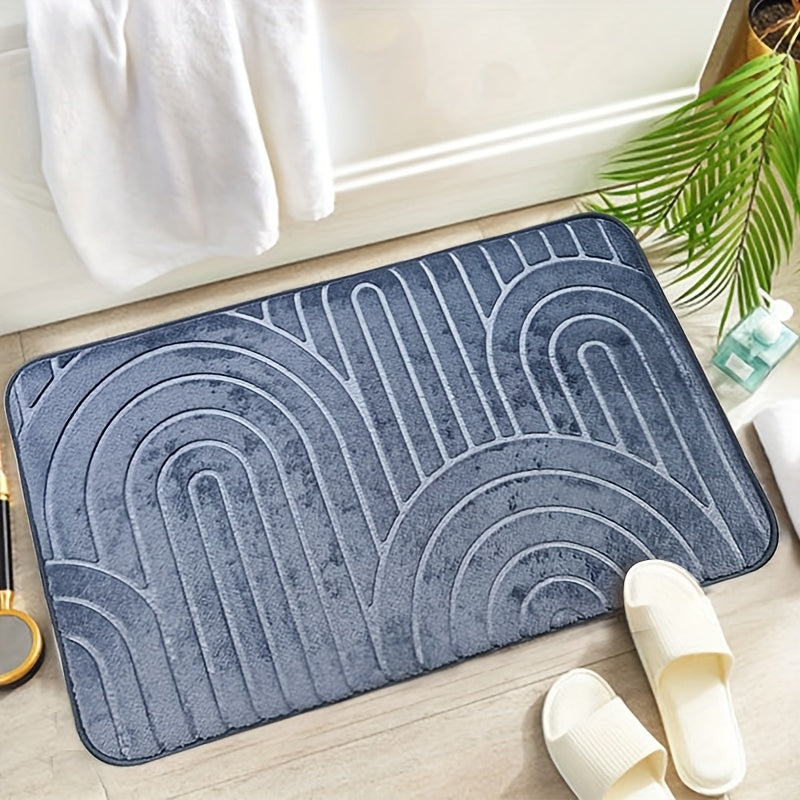 Tapis de bain en polyester doux, posé sur un sol de salle de bain