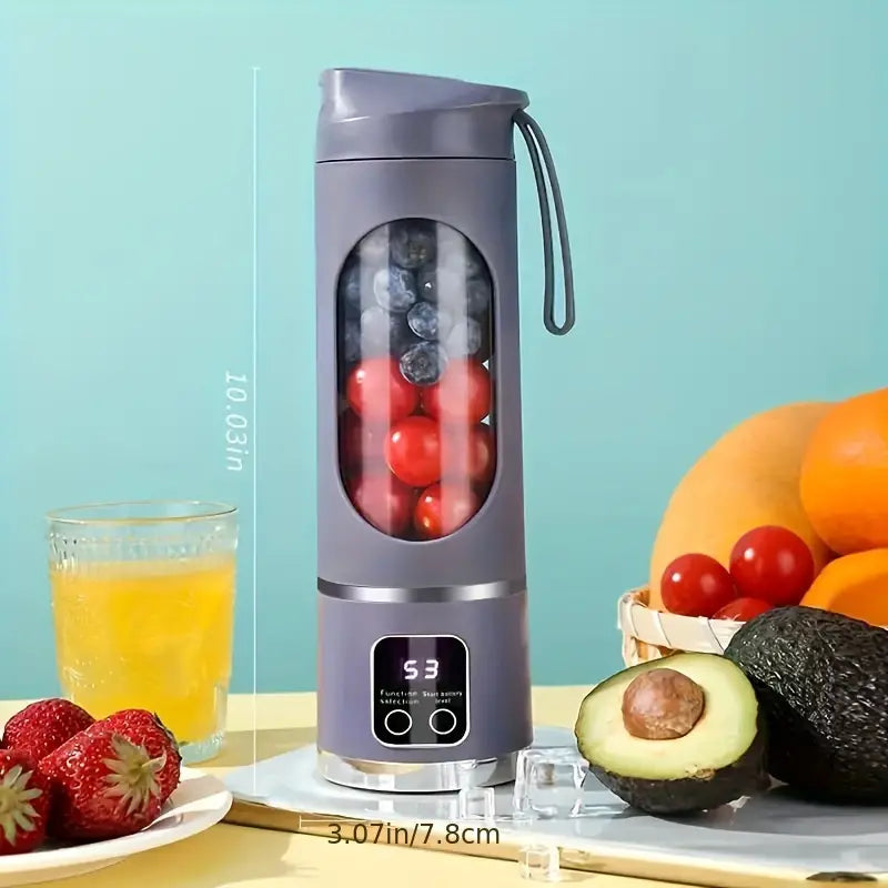 Mixeur portable en fonctionnement avec fruits à l'intérieur