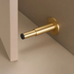 Butée de porte en laiton avec finition lisse vue de côté