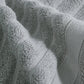 Serviette en coton pliée, montrant sa finition soignée