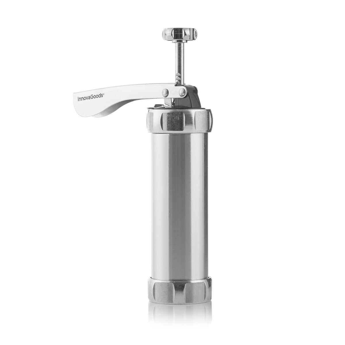 Presse à biscuits avec gabarits et buses sur une table