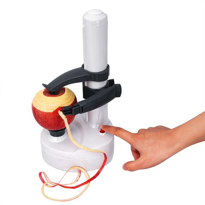 Éplucheur automatique avec différents fruits et légumes autour