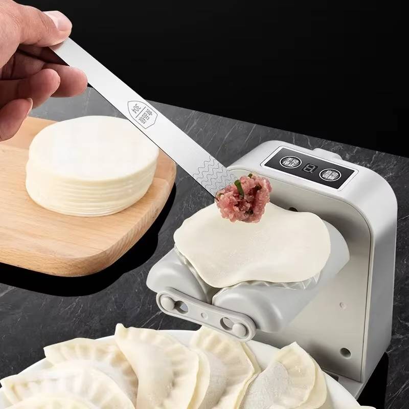 Machine à raviolis électrique avec plateforme de pliage