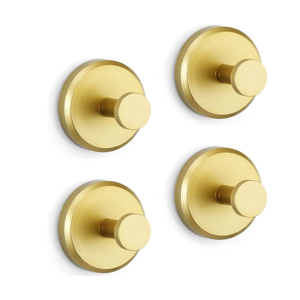 Ensemble de quatre crochets dorés, alignés de face