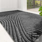 Tapis vert sur sol carrelé, empêchant glissades
