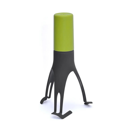 Cuillère à remuer automatique posée sur un plan de travail